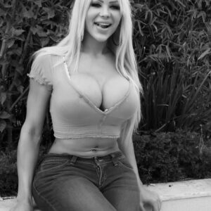Big boobed blonde tranny Azeneth Sabrok strutting in jeans before getting naked