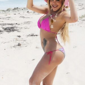 Beautiful blonde tranny Karla Carrillo freeing big boobs from bikini on beach