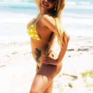 TS pornstar Karla Carrillo letting big dick loose from bikini on beach in sunglasses