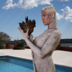 Inked blonde trans girl Danni Daniels poses for a great nude solo shoot by a pool