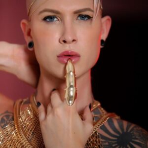 Tattooed blonde transsexual model Danni Daniels strikes contemplative solo poses