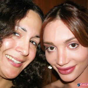 Tranny pornstars Mariana Cordoba and Nikki Montero take nude self shots in a mirror