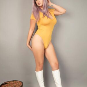 Trans model Bailey Jay sets her enhanced breasts loose in white knee socks