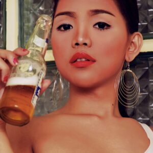 Teen ladyboy Amor exposes her nipples while drinking a beer in high-heeled shoes