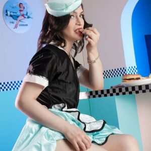 Black-haired trans model Alisa Rayne shows her butt and cock while waitressing