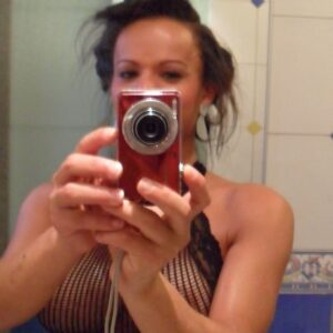 Latina trans babe Joyce Kelly exposes her big tits during self shot action in a mirror