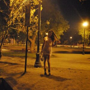 Tgirl prostitute Nikki Montero stands naked on a street