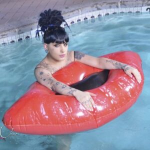 Inked trans girl Kelly Clare exchanges oral sex with the pool cleaner