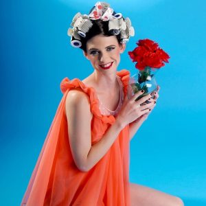 Thin shemale Mandy Mitchell gets nude with her hair in curlers for a retro shoot
