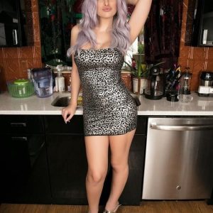 Platinum blonde trans chick Bailey Jay frees her tits from a dress
