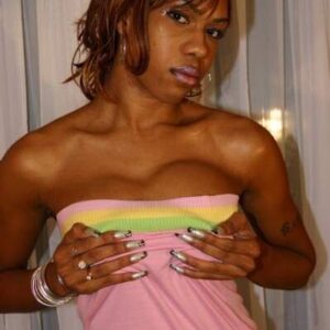 Redheaded ebony shemale Sexxxy Jade unveils her big tits prior to jerking off