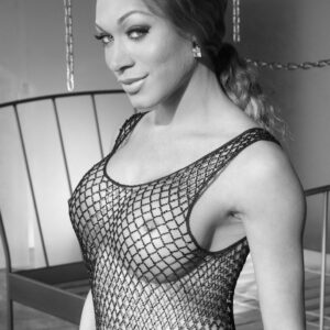 Trans solo girl Mia Isabella drapes herself in chain while wearing mesh clothing