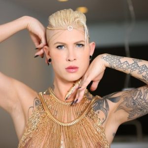 Tattooed blonde trans model Danni Daniels strikes great solo poses