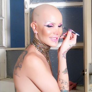 Trans pornstar Blondie Johnson shows her long cock in a bathroom