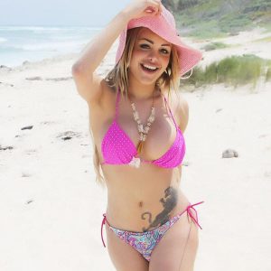 Beautiful blonde trans girl Karla Carrillo releases her tits from swimwear